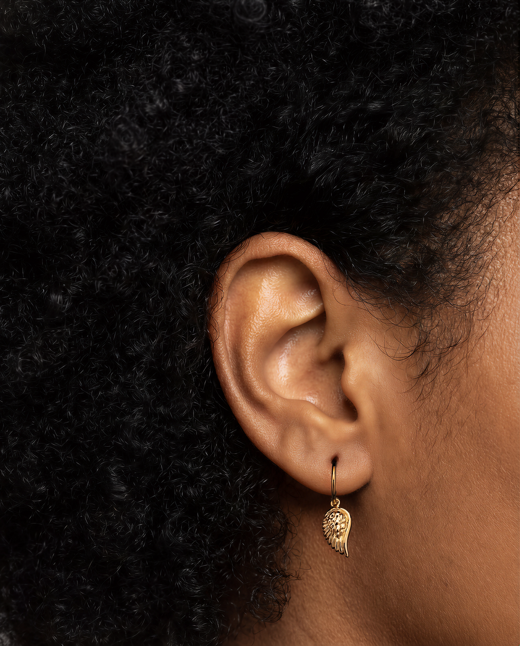 The Wing -18K yellow gold hoop earrings and a wing charm