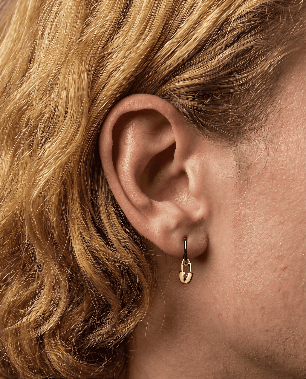 The Safety Pin - 18K yellow gold hoop earrings and a safety pin charm