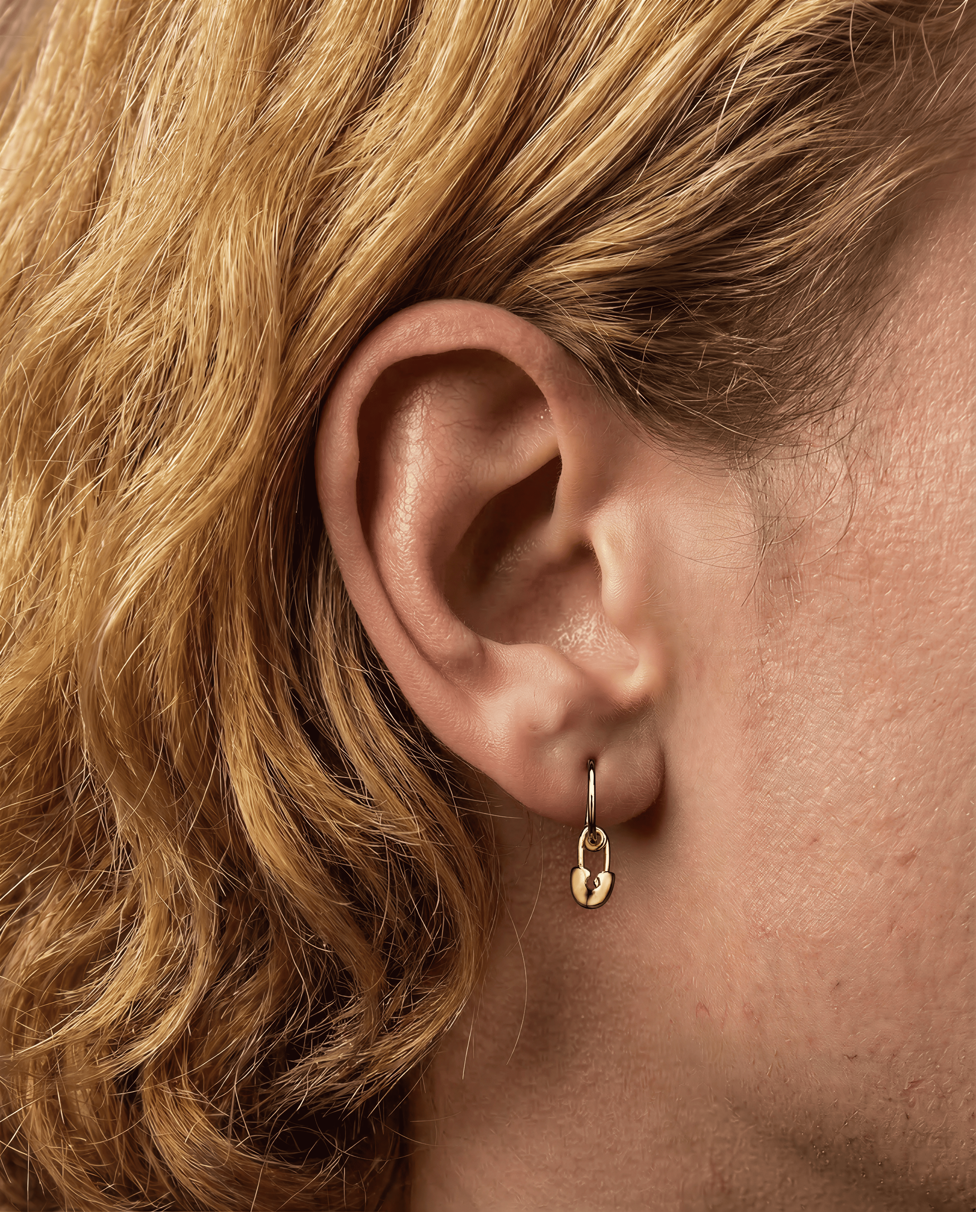 The Safety Pin - 18K yellow gold hoop earrings and a safety pin charm